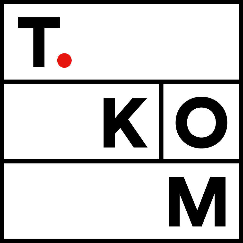 T.KOM